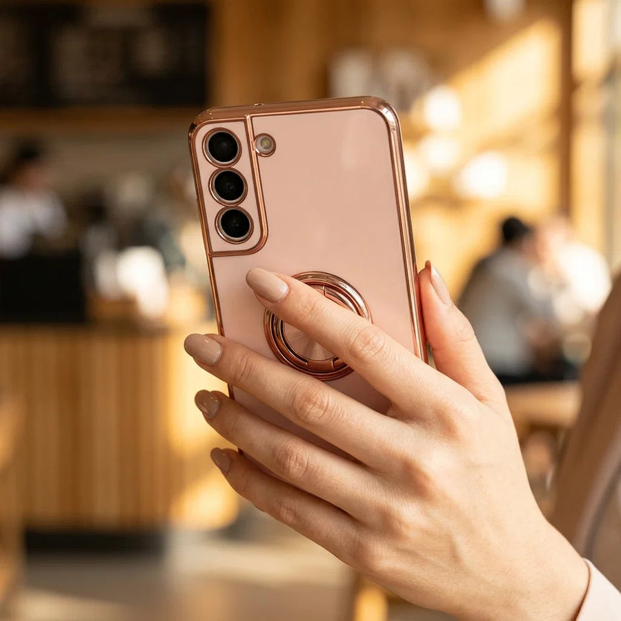 Hand holding a Samsung Galaxy using the ring holder grip